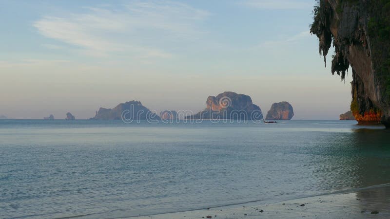 Tropical beach and rocks at dawn