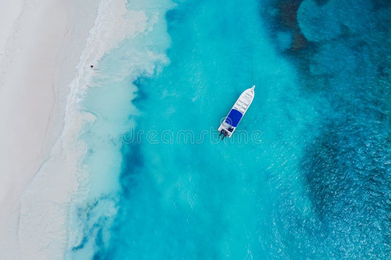 Tropical carribbean beach. Beautiful caribbean beach on Saona island, Dominican Republic. Aerial abstract view of tropical idyllic summer landscape with blue sea