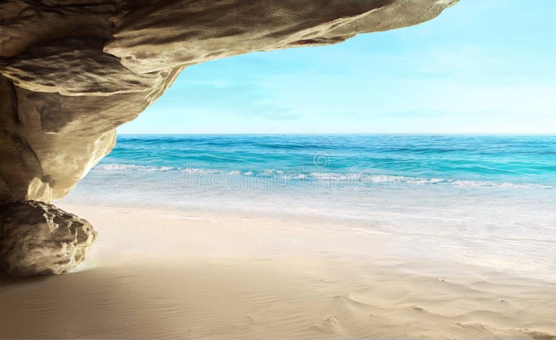 View of tropical cave and beach.