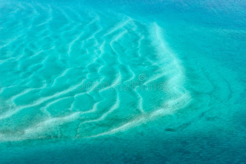 Aerial view of shallow coastal waters of the tropical coast of Mozambique, southern Africa. Aerial view of shallow coastal waters of the tropical coast of Mozambique, southern Africa