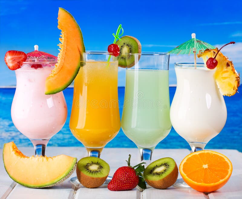 Tropical cocktails with fresh fruits stock photography