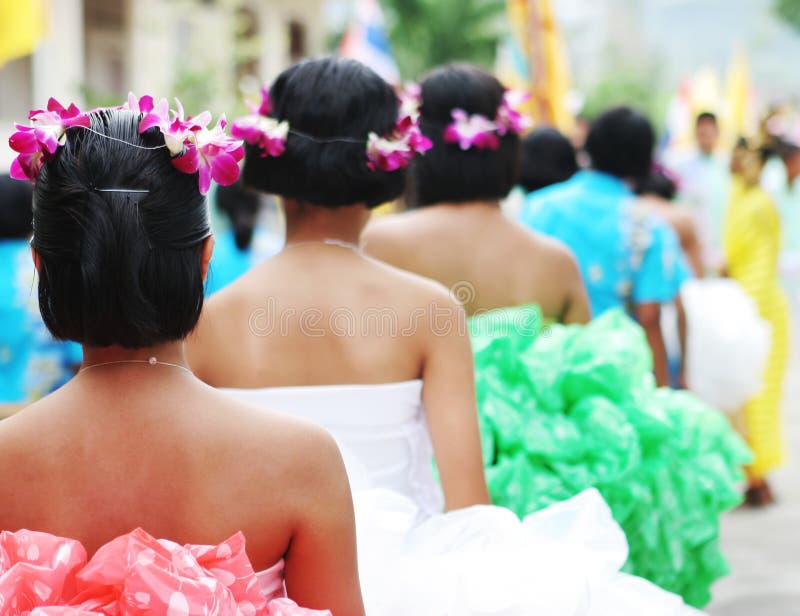 Tropical dancers prepare to perform a traditional dance