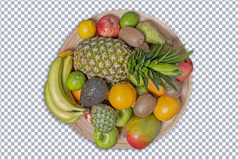 Tropical fruit in a circular wooden fruit bowl, isolated