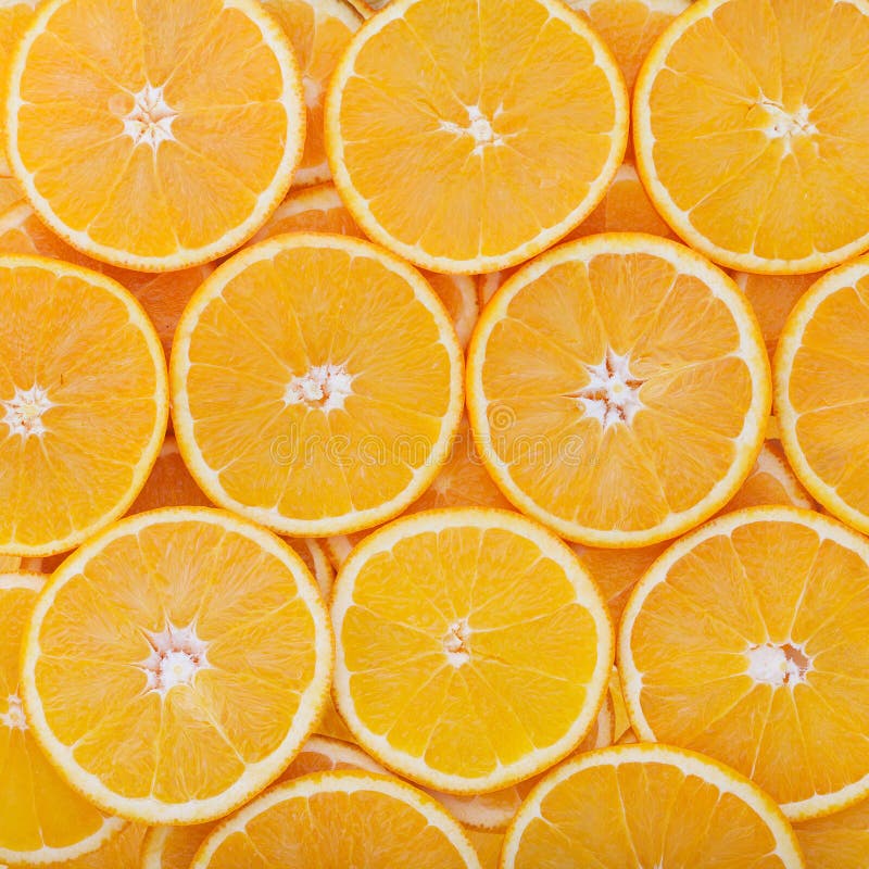 Tropical fruit cut circles as background royalty free stock photo
