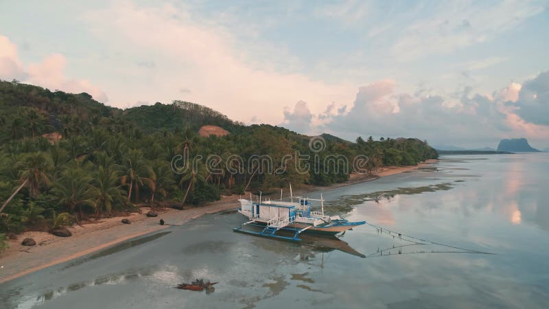Tropical island coast boat tour. Aerial landscape sunset light. Nature background. Wild landscape