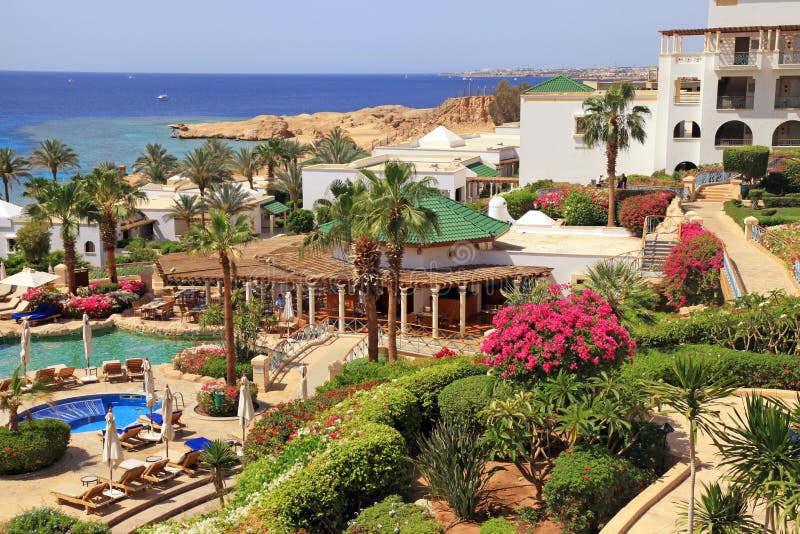 SHARM EL SHEIKH, EGYPT - MAY 03, 2014: Tropical luxury resort hotel on Red Sea beach in Sharm el Sheikh, Egypt. SHARM EL SHEIKH, EGYPT - MAY 03, 2014: Tropical luxury resort hotel on Red Sea beach in Sharm el Sheikh, Egypt.