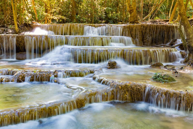 Tropical multiple layers stream waterfall in deep forest stock image
