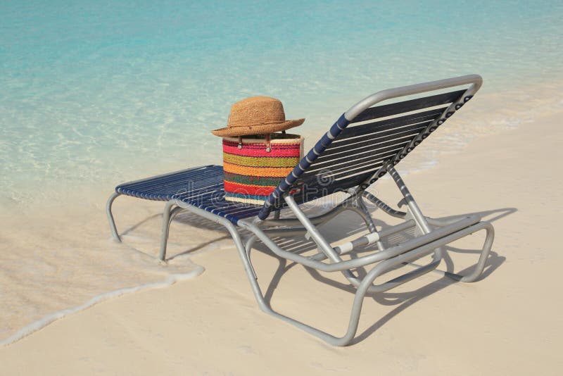 Tropical ocean beach and straw hat