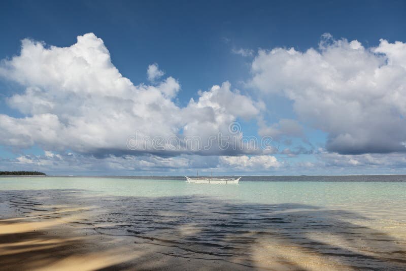 Tropical ocean with fishermen boat