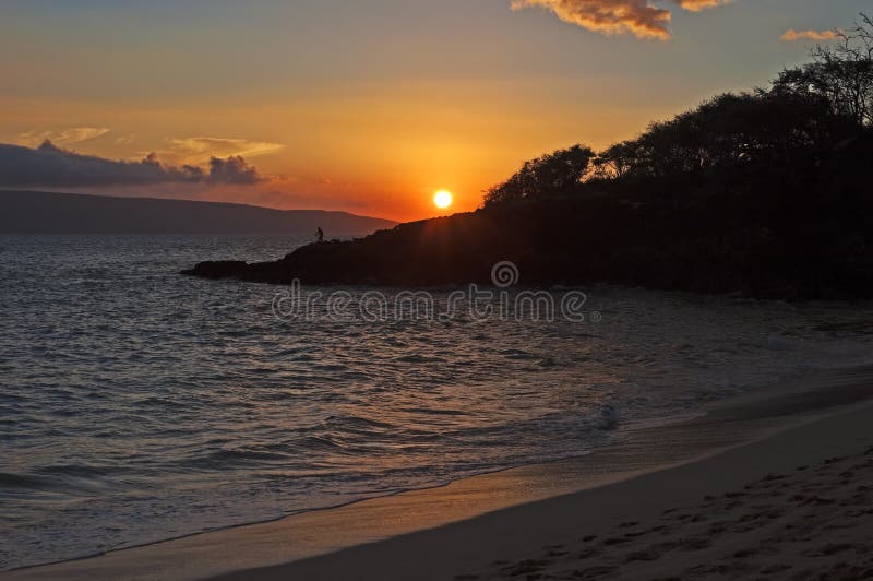 Tropical sunset with fisherman