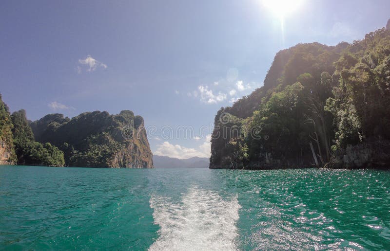 Tropical Thai jungle lake Cheo lan wood boat, wild mountains nature national park ship yacht rocks