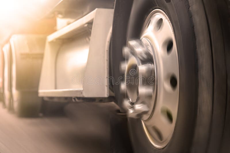 Truck driving on road. truck wheel closeup, transportation, Motion blur stock photo Truck driving on road. truck wheel closeup, transportation, Motion blur stock photo
