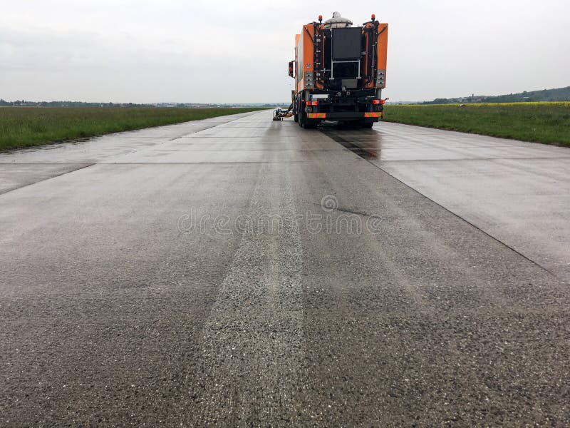 Truck with equipment for removal of the traffic marking stock images Truck with equipment for removal of the traffic marking stock images