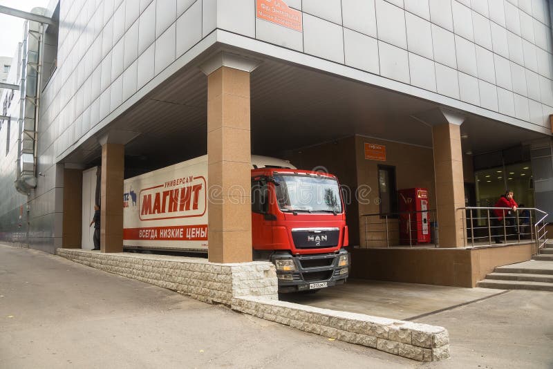 Truck MAN at unloading at the shopping center