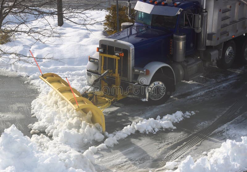Truck Plowing Snow on Street royalty free stock photos