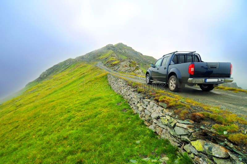 A truck parked on a narrow pull off along the Transalpina in the Carpathian Mountains. Transalpina stock images, royalty-free photos and pictures