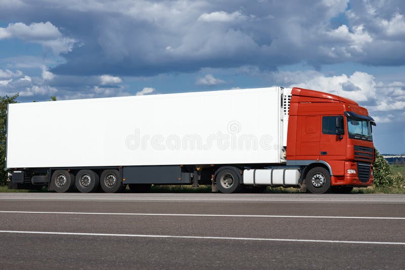 Truck on road with white blank container, blue sky, cargo transportation concept stock image