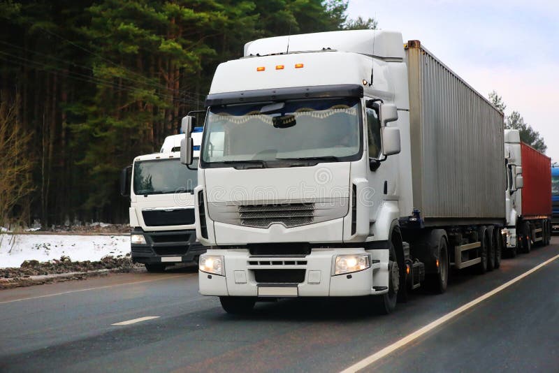 Trucks go on the highway in the winter