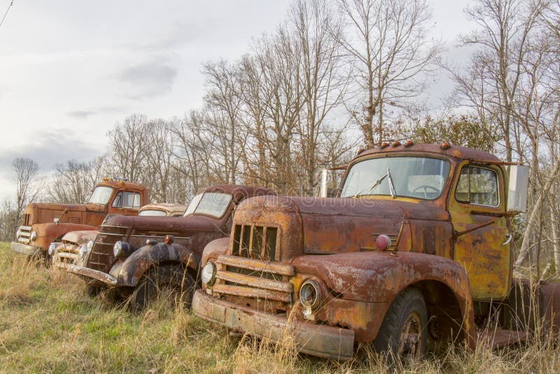 Trucks rusting n field