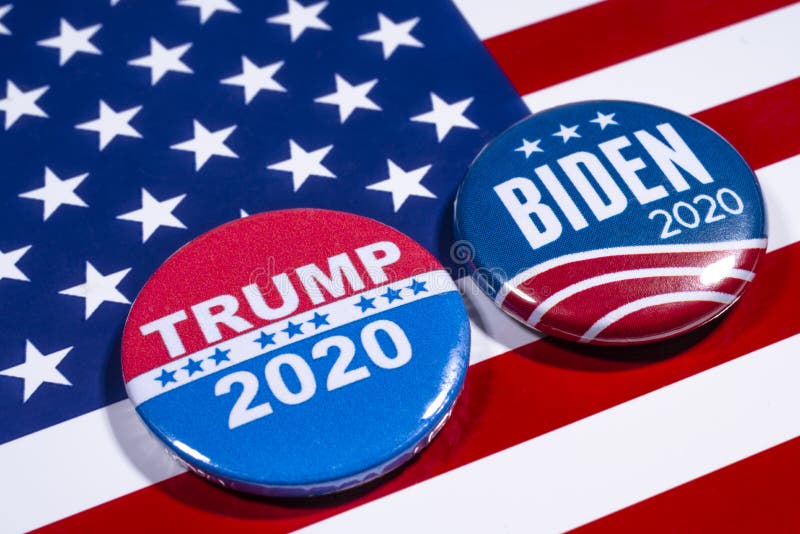 London, UK - May 5th 2020: Donald Trump and Joe Biden pin badges, pictured of the USA flag.  The two men will be battling eachother in the 2020 US Presidential Election. London, UK - May 5th 2020: Donald Trump and Joe Biden pin badges, pictured of the USA flag.  The two men will be battling eachother in the 2020 US Presidential Election