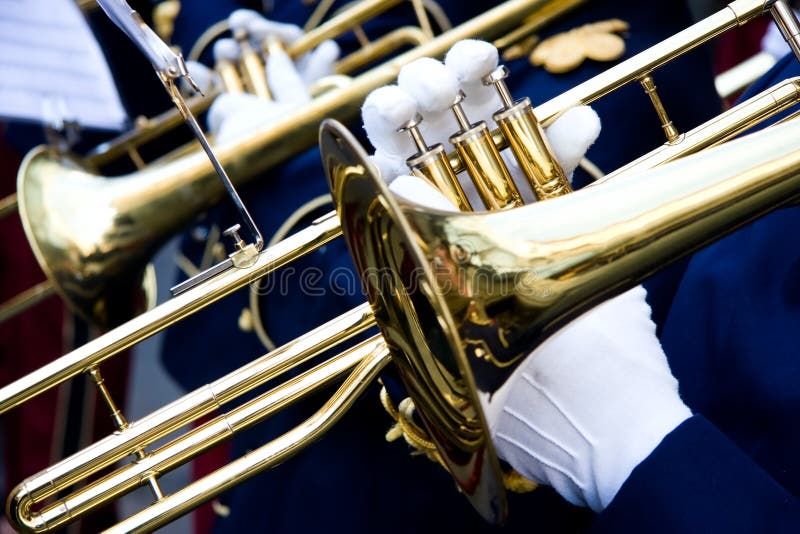 A trumpeter plays in a music band, closeup