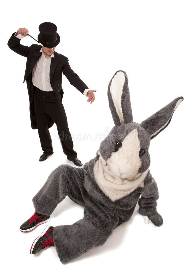 Luckless magician conjuring with a inconceivable rabbit over white background. Luckless magician conjuring with a inconceivable rabbit over white background