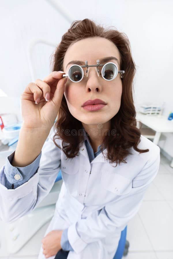 Trying on Medical Spectacles, Serious Stock Image Image of care