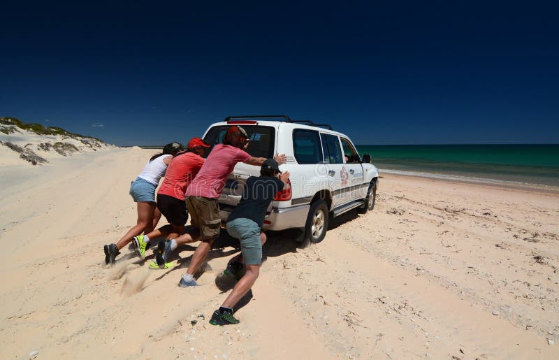 Trying to unstuck the car from the sand. Bottle bay. FranÃ§ois Peron national park. Shark Bay. Western Australia