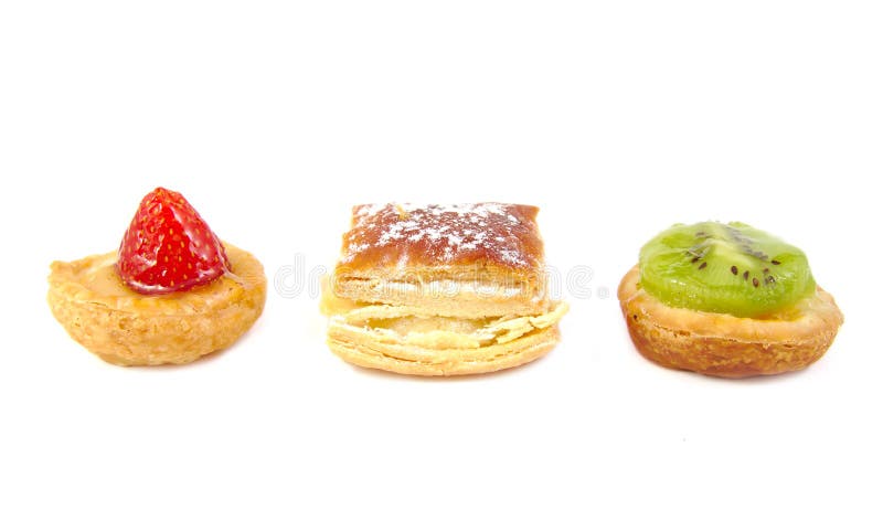 Trzy hiszpańskiego pastelitos: mały kiwi, truskawka fotografia stock Trzy hiszpańskiego pastelitos: mały kiwi, truskawka fotografia stock