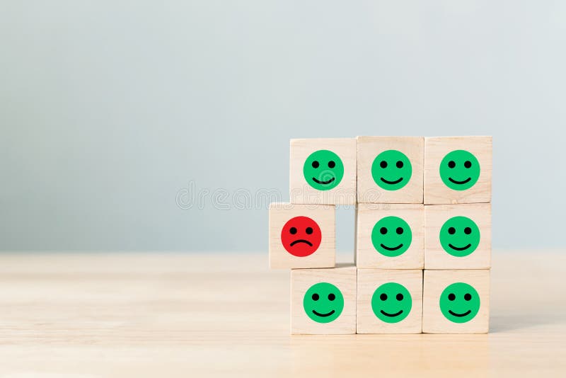 Wooden block with icon face emotion happiness and sadness, Unique, think different, individual. Wooden block with icon face emotion happiness and sadness, Unique, think different, individual