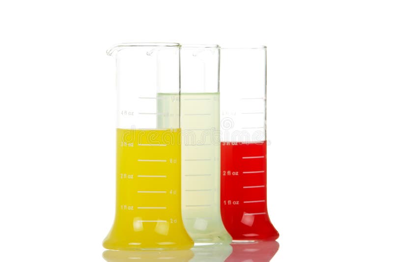 Three test flasks with liquids reflected on white background. Shallow DOF. Three test flasks with liquids reflected on white background. Shallow DOF