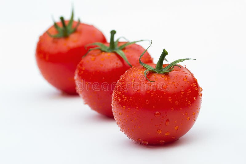 Três tomates foto de stock royalty free Três tomates foto de stock royalty free
