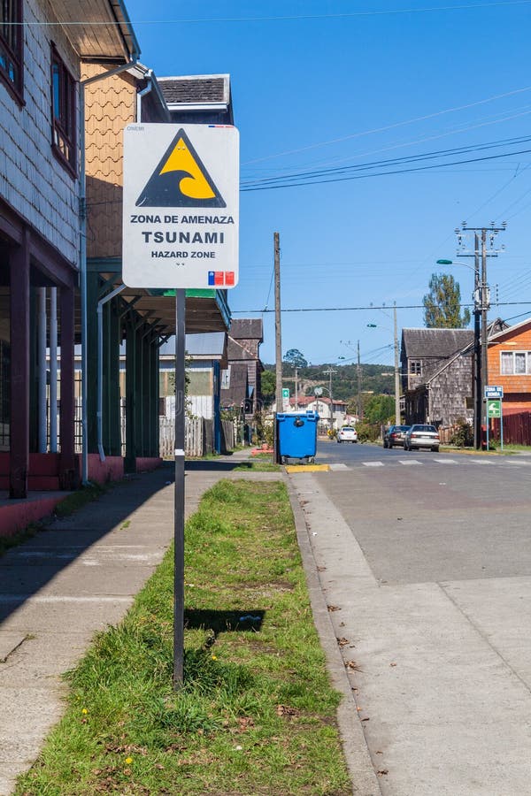 Tsunami Hazard Zone Sign in Curaco de Velez village, Chi stock image Tsunami Hazard Zone Sign in Curaco de Velez village, Chi stock image