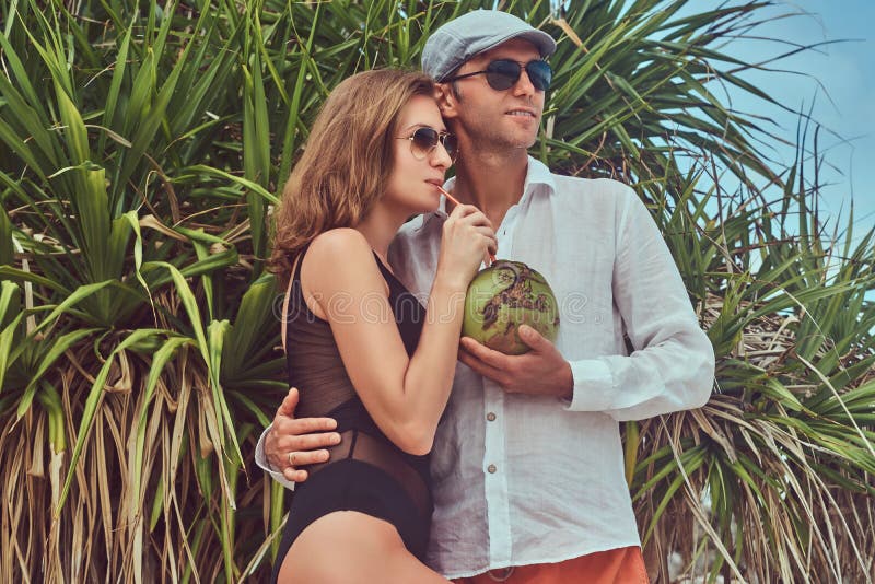Chronic FALSE space Attractive Couple, Holds Coconut with a Tube, Posing on a Beach Near Palm  Bush, Enjoys a Vacation on a Beautiful Island. Stock Image - Image of  beautiful, palm: 116112703