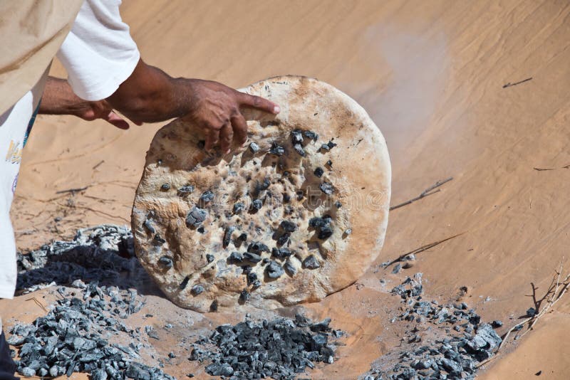 Tuareg man preparing the traditional bread