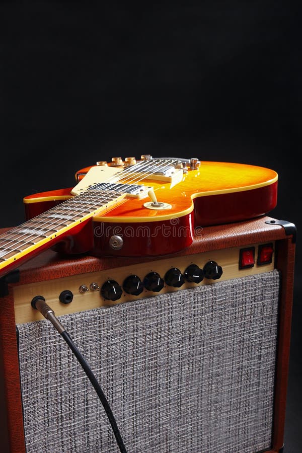 Tube Amplifier for Electric Guitar with Guitar, Glass of Beer and