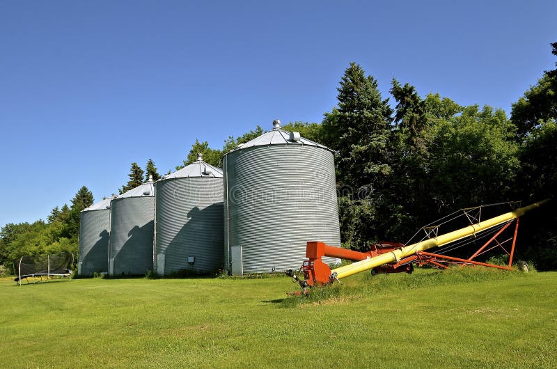 Tube Elevator and Grain Bins in a Small Town Stock Photo Image of