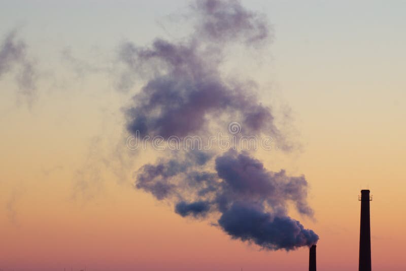 Tubes polluting in sunrise sky