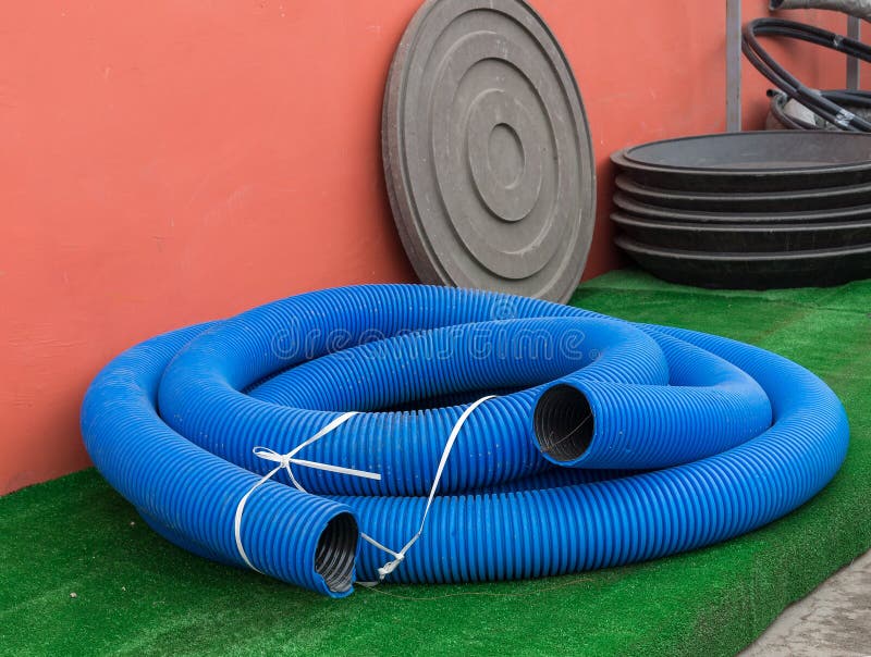 Blue thick hose on a green background. Blue thick hose on a green background