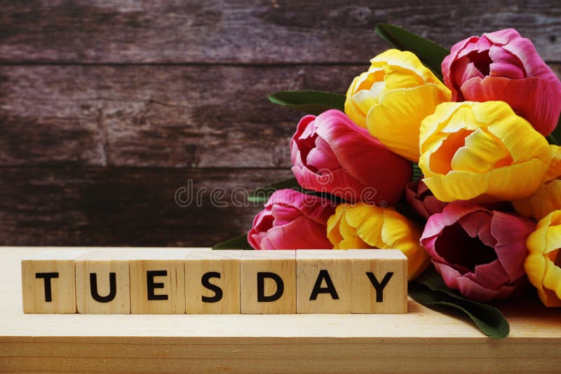 Tuesday Alphabet Letter and Tulip Flowers Bouquet on Wooden Background ...