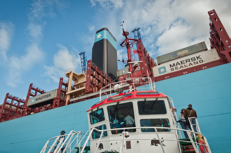 Tugboat and Maersk Container Ship in Poland Editorial Stock Image