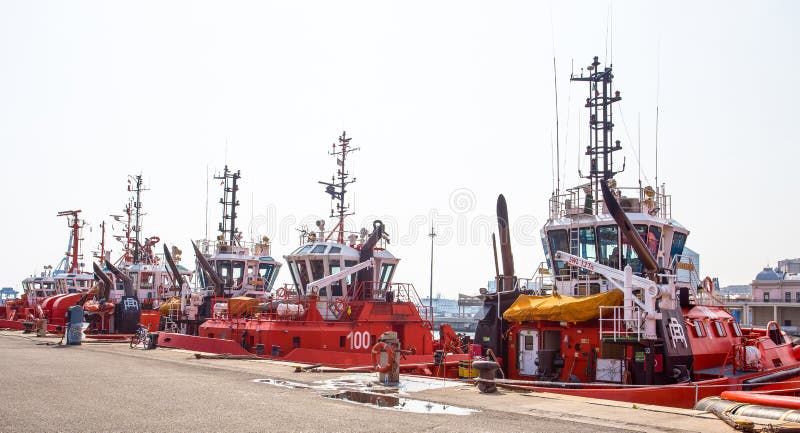 Tugboats moored in the port of Genoa, Italy, Europe. Tugboats moored in the port of Genoa, Italy, Europe.