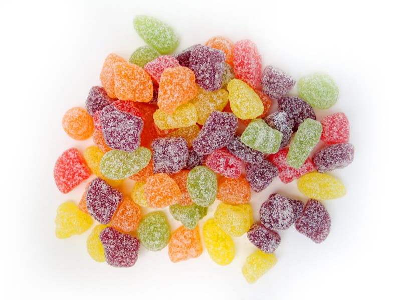 Sour fruit candies scattered on a white background. Sour fruit candies scattered on a white background.