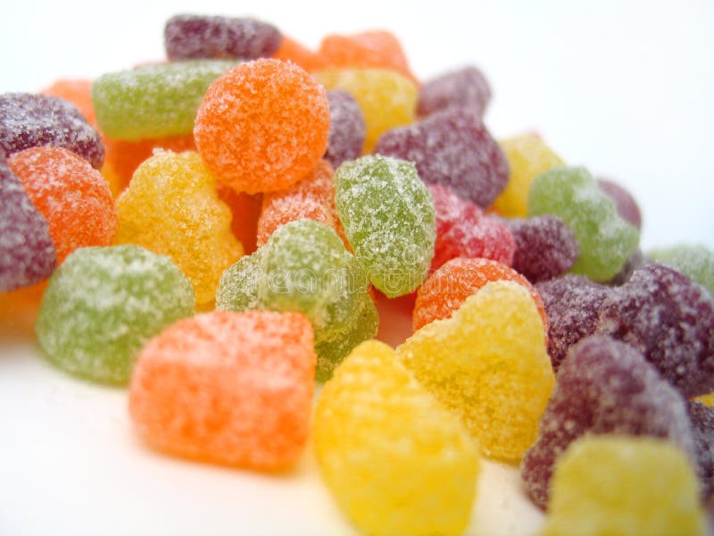 Macro shot of a bunch of sour fruit chews. Focus mainly in the center of the composition. Macro shot of a bunch of sour fruit chews. Focus mainly in the center of the composition.