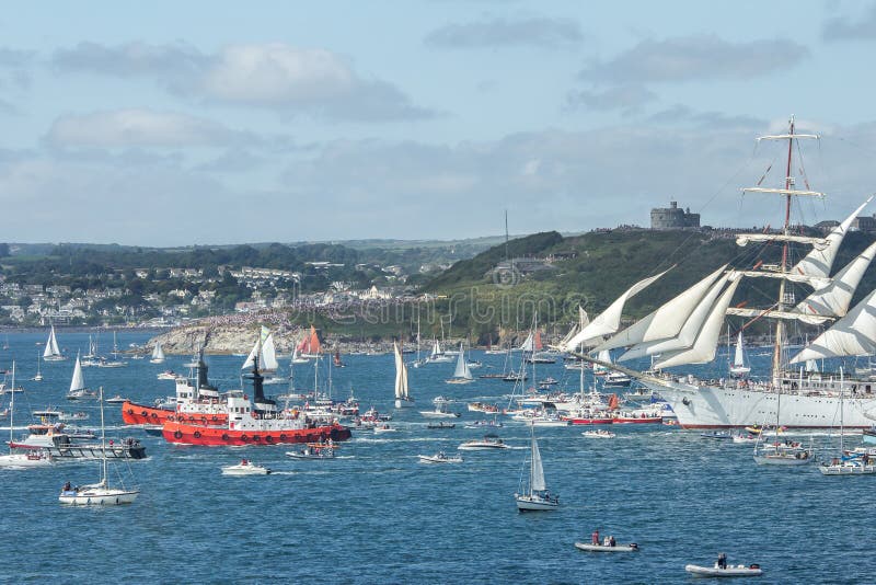 Tugs guide Tall Ship to Sea at the Tall Ships Festival, Falmouth, Cornwall