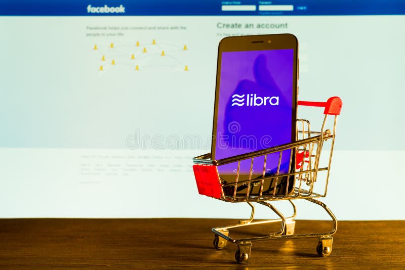 Tula, Russia - 4 July 2019 : Libra coin blockchain concept with smartphone on shopping cart next to the computer monitor stock photos Tula, Russia - 4 July 2019 : Libra coin blockchain concept with smartphone on shopping cart next to the computer monitor stock photos
