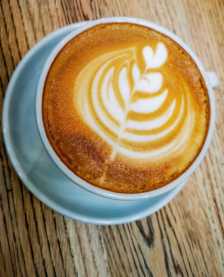 Tulip Latte Art on Cafe Latte on Wooden Table Stock Image - Image of
