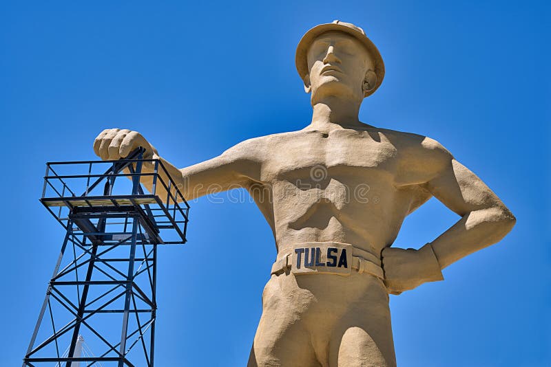 `A version of the Golden Driller was originally built in 1952 by the Mid-Continent Supply Company of Fort Worth as a temporary feature of the International Petroleum Exposition. Six years later, one was erected again for the 1959 show. Due to the positive attention it attracted, the company donated the statue to the Tulsa County Fairgrounds Trust Authority which had it anatomically redesigned [3] and permanently installed in front of the Tulsa Expo Center for the 1966 International Petroleum Exposition. The statue`s right hand rests on an oil derrick which had been moved from a depleted oil field in Seminole, Oklahoma.
An inscription at the base of the statue reads: `The Golden Driller, a symbol of the International Petroleum Exposition. Dedicated to the men of the petroleum industry who by their vision and daring have created from God`s abundance a better life for mankind.`. `A version of the Golden Driller was originally built in 1952 by the Mid-Continent Supply Company of Fort Worth as a temporary feature of the International Petroleum Exposition. Six years later, one was erected again for the 1959 show. Due to the positive attention it attracted, the company donated the statue to the Tulsa County Fairgrounds Trust Authority which had it anatomically redesigned [3] and permanently installed in front of the Tulsa Expo Center for the 1966 International Petroleum Exposition. The statue`s right hand rests on an oil derrick which had been moved from a depleted oil field in Seminole, Oklahoma.
An inscription at the base of the statue reads: `The Golden Driller, a symbol of the International Petroleum Exposition. Dedicated to the men of the petroleum industry who by their vision and daring have created from God`s abundance a better life for mankind.`