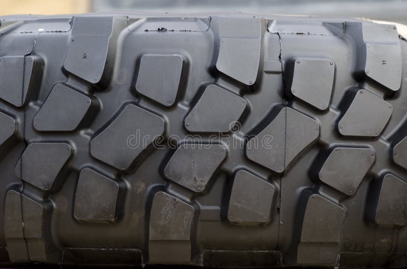 Rubber tire tread texture of a tractor or other heavy duty construction machinery. Rubber tire tread texture of a tractor or other heavy duty construction machinery.