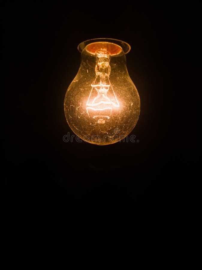 Tungsten Incandescent Lamp Isolated on Black Background Stock Image